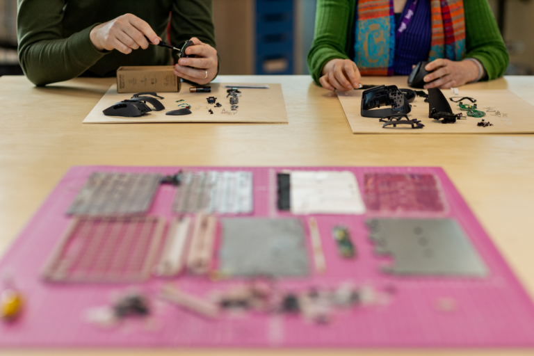 two people working on an electronics project