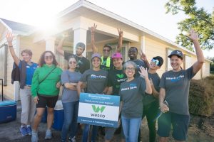 Team Wesco shown in front of the house that they worked on during the ream build.