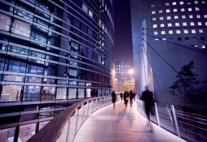 People walking in city at night