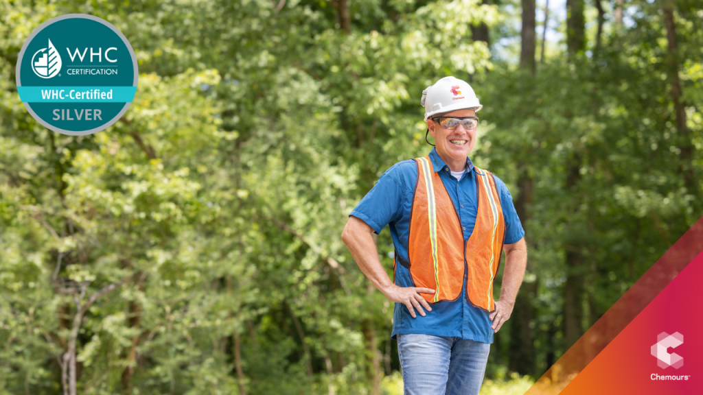 Chemours employee standing in a forest