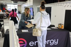 Entergy employee helping a customer at a desk